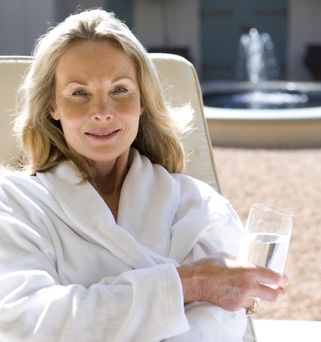 Woman relaxing with a glass of water